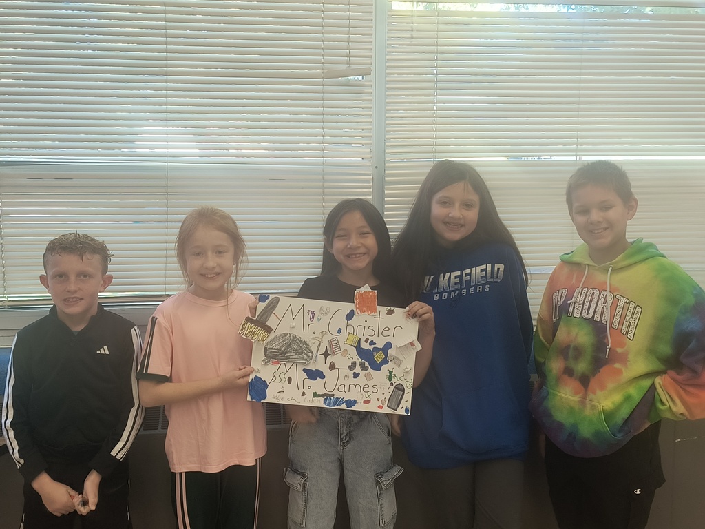 On National Custodians Day, Mrs. Simnitt's 4th graders created personalized posters and presented them to Mr. Langley and Mr. Dunlap.