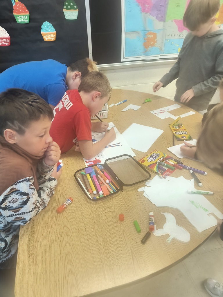 On National Custodians Day, Mrs. Simnitt's 4th graders created personalized posters and presented them to Mr. Langley and Mr. Dunlap.