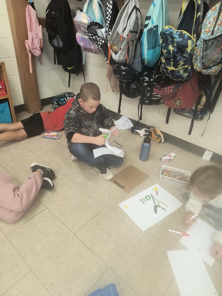 On National Custodians Day, Mrs. Simnitt's 4th graders created personalized posters and presented them to Mr. Langley and Mr. Dunlap.