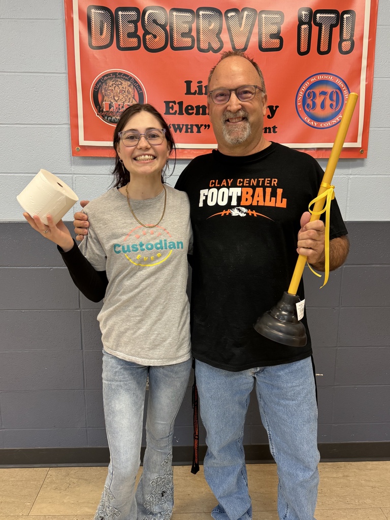 In honor of National Custodian Appreciation Day, LES hosted a Minute to Win It challenge for Phil and Skylee where they had to stack toilet paper rolls.