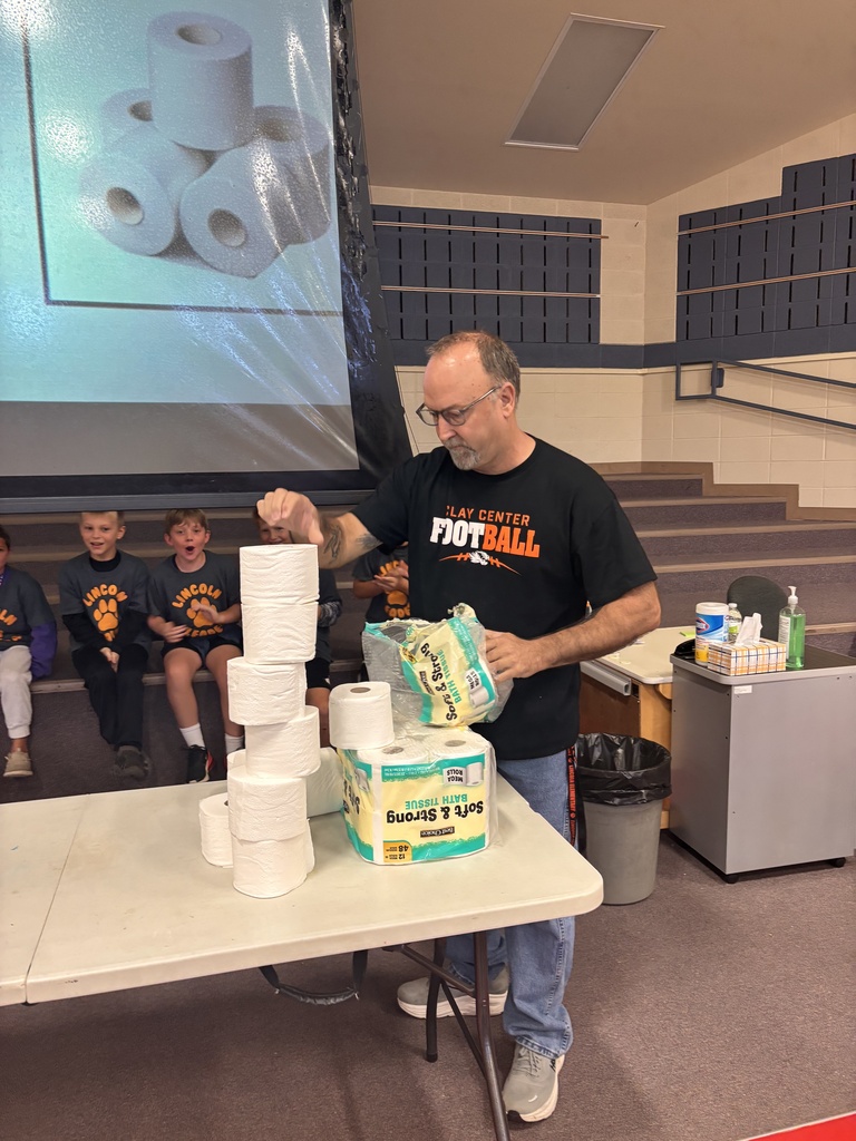 In honor of National Custodian Appreciation Day, LES hosted a Minute to Win It challenge for Phil and Skylee where they had to stack toilet paper rolls.