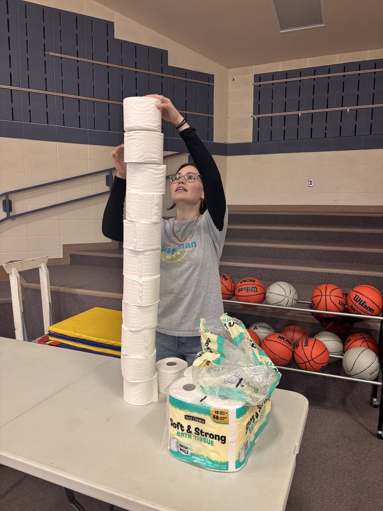 In honor of National Custodian Appreciation Day, LES hosted a Minute to Win It challenge for Phil and Skylee where they had to stack toilet paper rolls.
