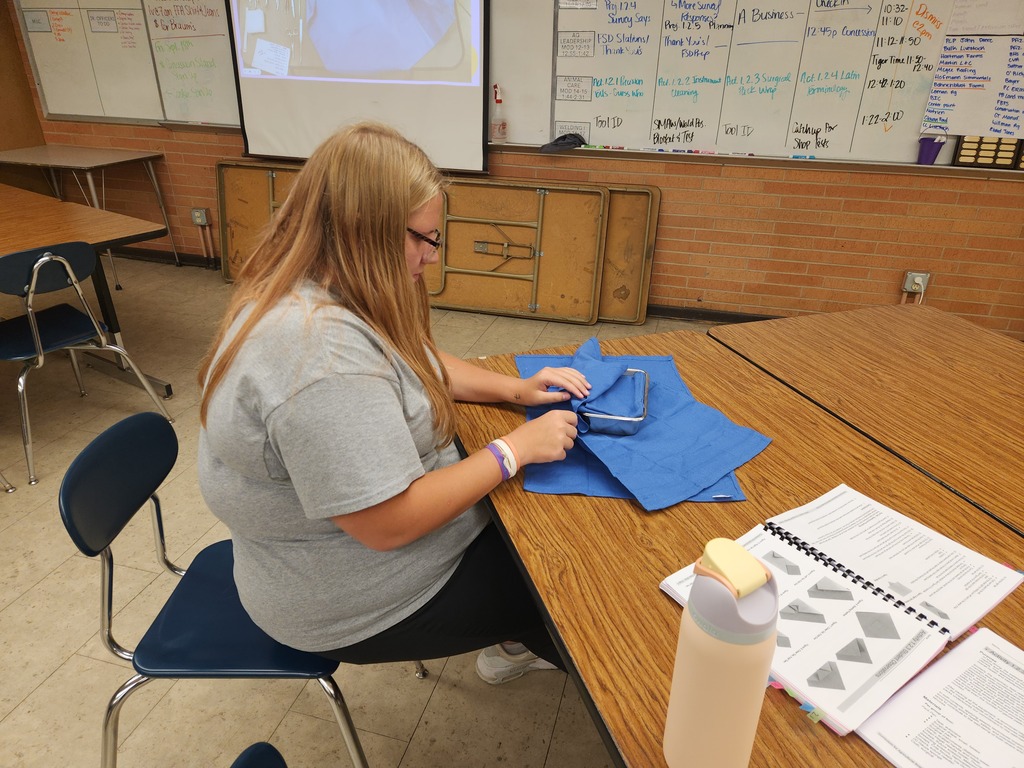 Mrs. Flegler's Animal Care students cleaned surgical tools that were simulated to have contaminants and dried blood. Taking it a step further, they prepared and wrapped surgical packs according to a provided surgical pack recipe.