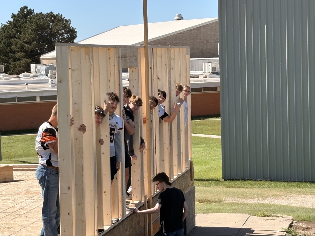 Construction tech students assemble and install the north wall of the Tiger House.