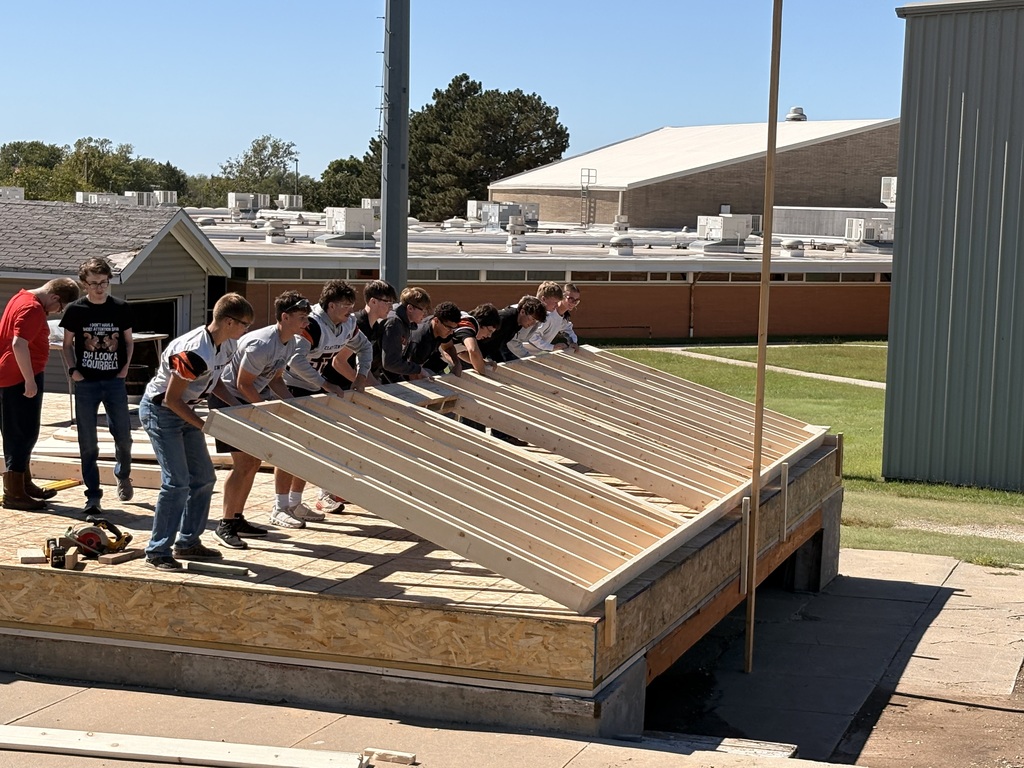 Construction tech students assemble and install the north wall of the Tiger House.