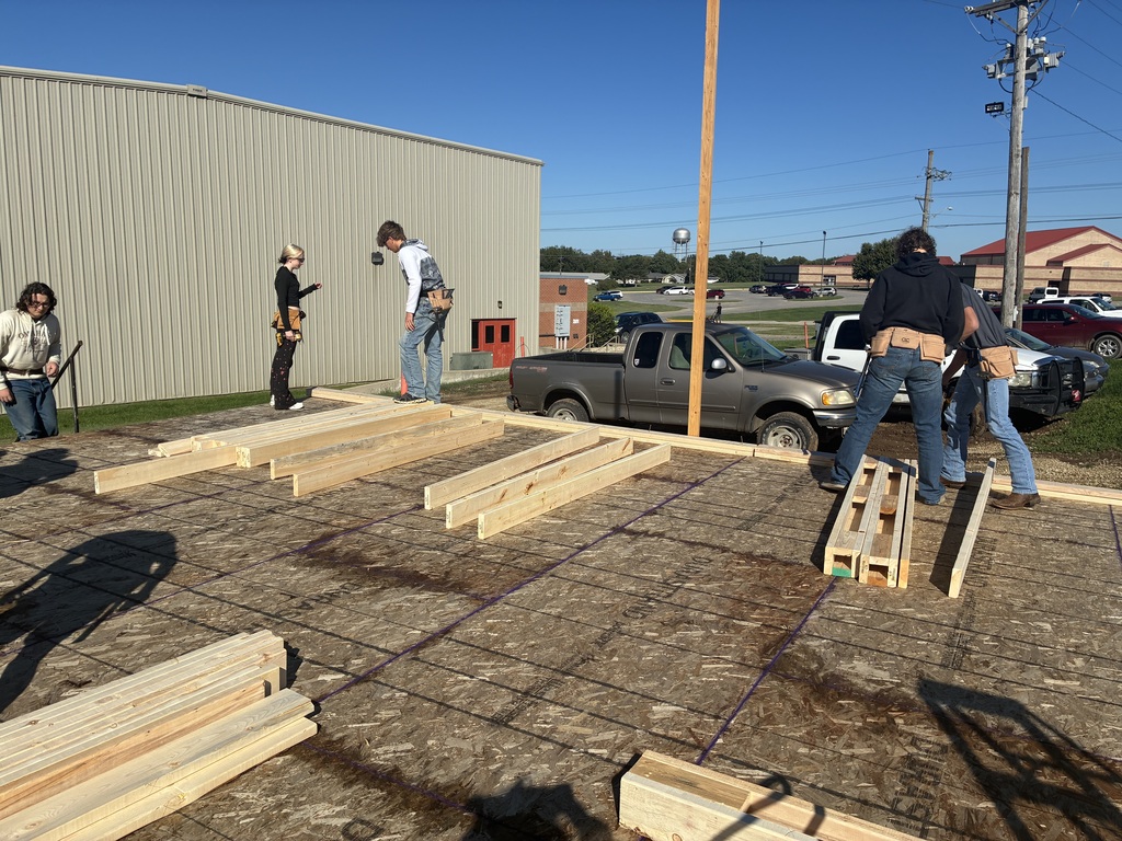 Construction tech students assemble and install the north wall of the Tiger House.