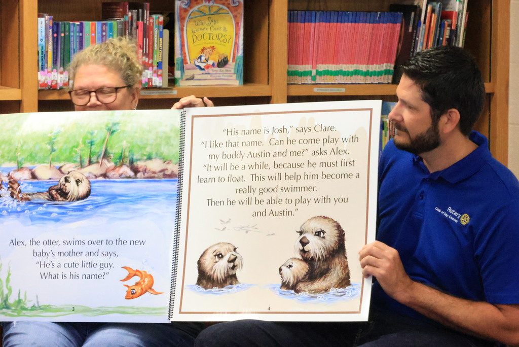 Clay Center Rotary members read Josh the Baby Otter book to Wakefield kindergarten and first grade students.