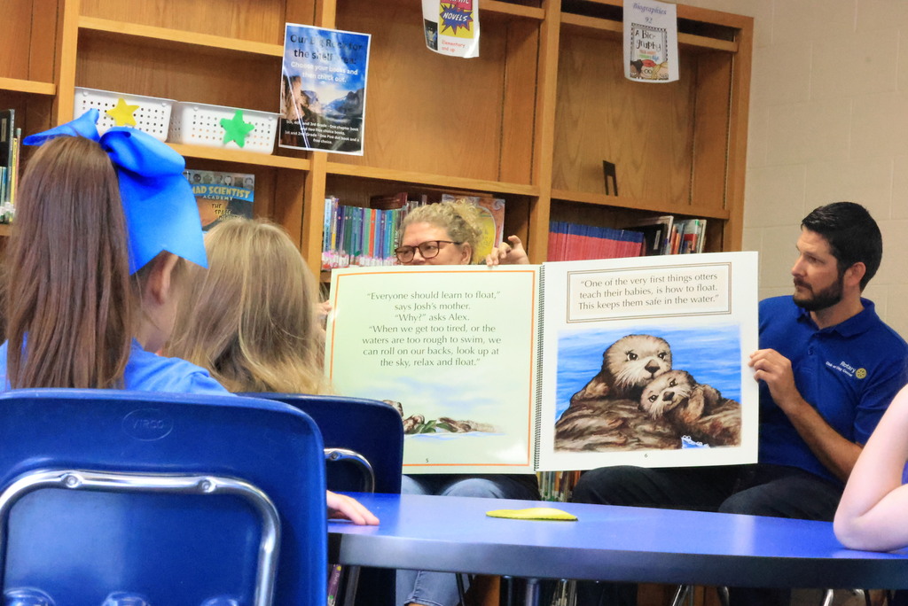 Clay Center Rotary members read Josh the Baby Otter book to Wakefield kindergarten and first grade students.