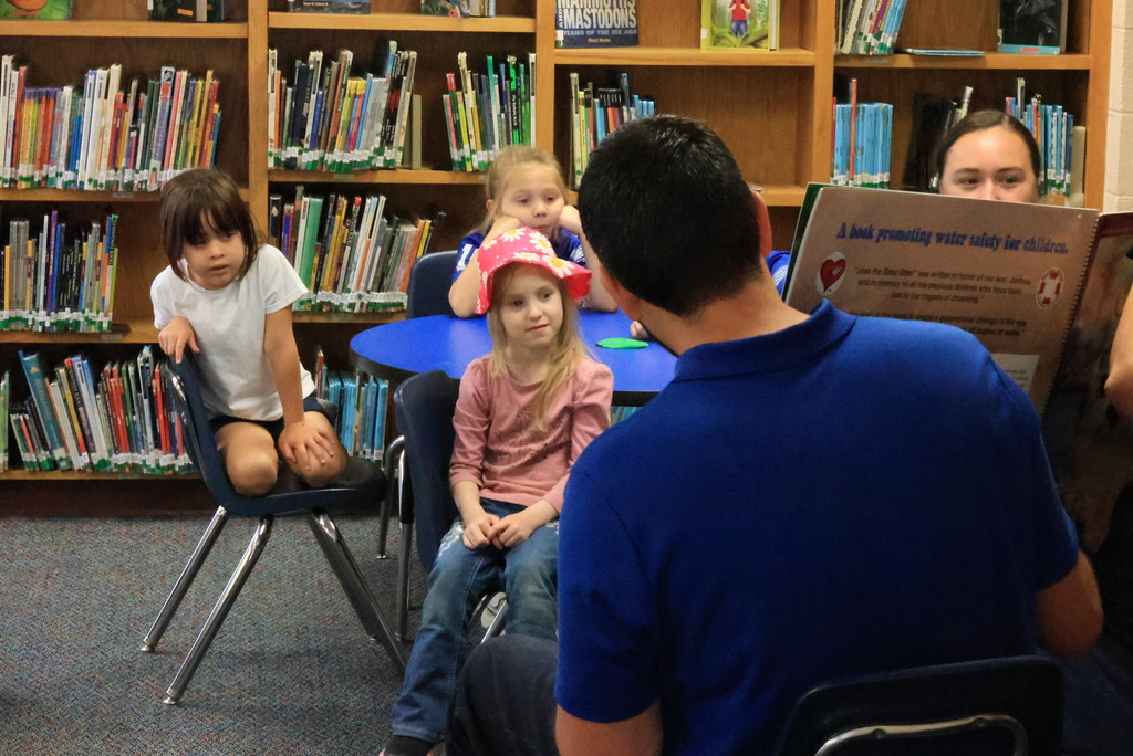 Clay Center Rotary members read Josh the Baby Otter book to Wakefield kindergarten and first grade students.