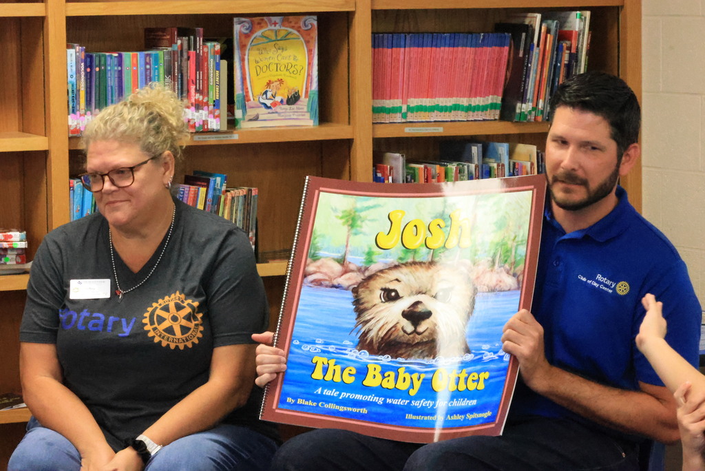 Clay Center Rotary members read Josh the Baby Otter book to Wakefield kindergarten and first grade students.