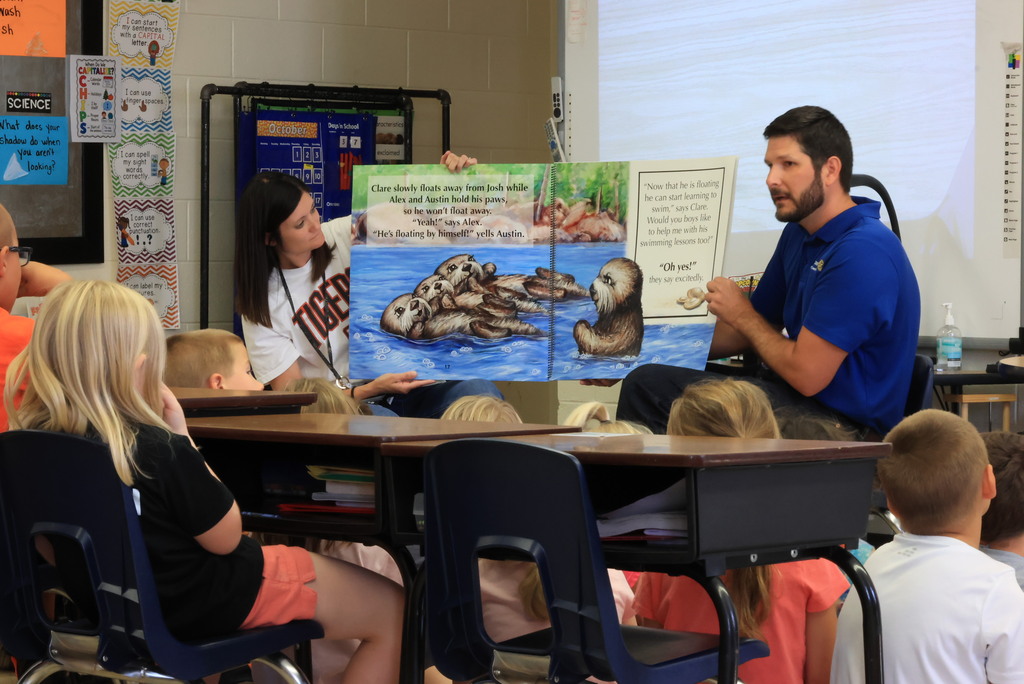 Clay Center Rotary members read "Josh, the Baby Otter" while promoting water safety.
