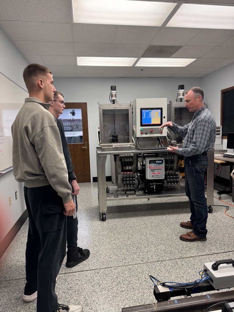 Executive Director Jeff Tucker and lead engineer Quinton Berggren explain the KSU Technology Development Institute's objectives to WHS students Max and Tim Bybee during a visit this week.