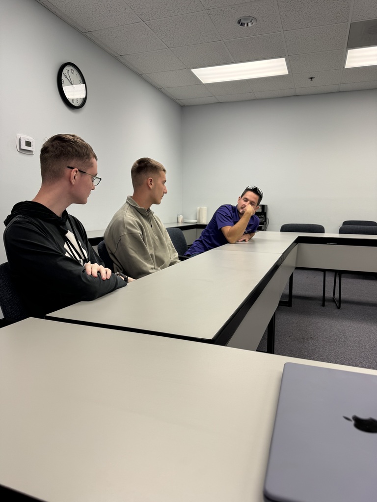 Executive Director Jeff Tucker and lead engineer Quinton Berggren explain the KSU Technology Development Institute's objectives to WHS students Max and Tim Bybee during a visit this week.