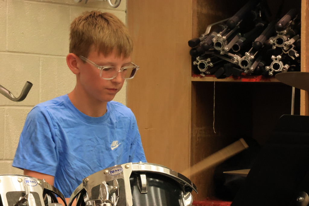 Mrs. Thrasher's band students practice their music for their marching band performance.