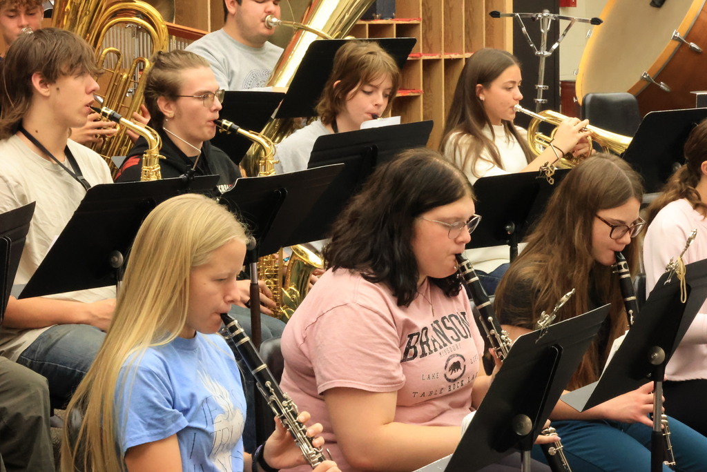 Mrs. Thrasher's band students practice their music for their marching band performance.