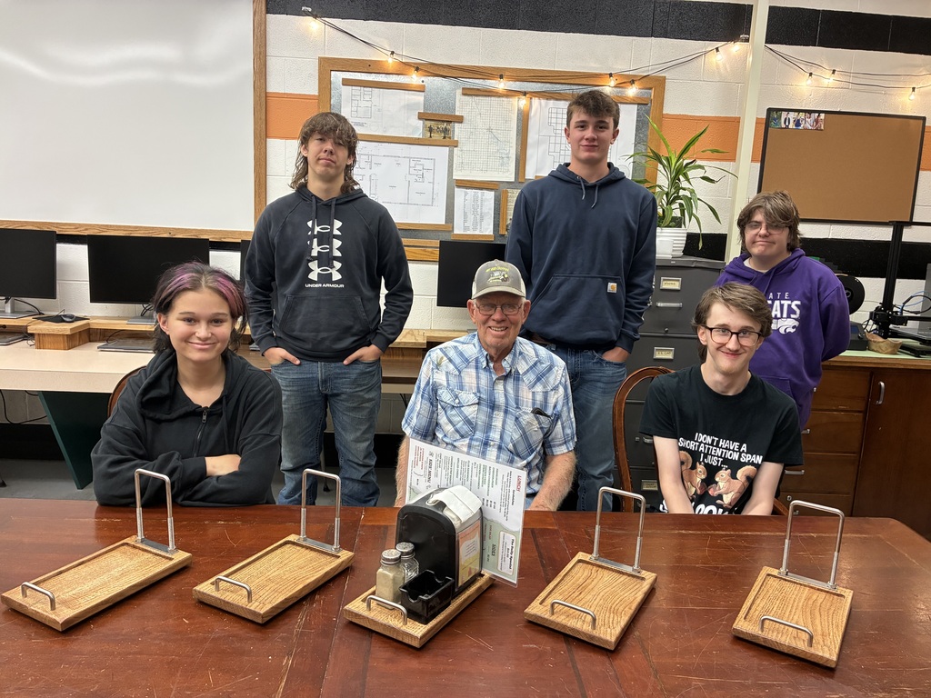 Back in August, Mrs. Schooley's Cabinetmaking students worked with the Green Community Cafe to create a holder for napkins, menus, salt and pepper shakers, and sugar containers. Today, they gave Mr. Lloyd the final product! 