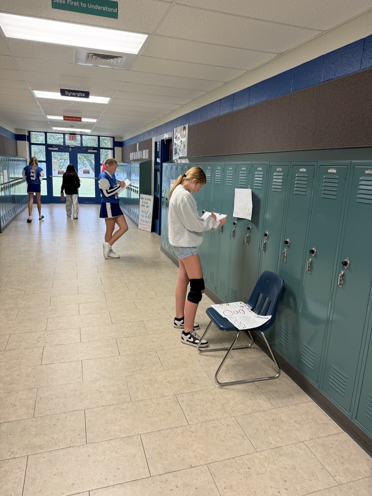 Mrs. Ehlers' 8th-grade ELA class participate in a Poetry Gallery Walk to showcase their creative writing skills. 