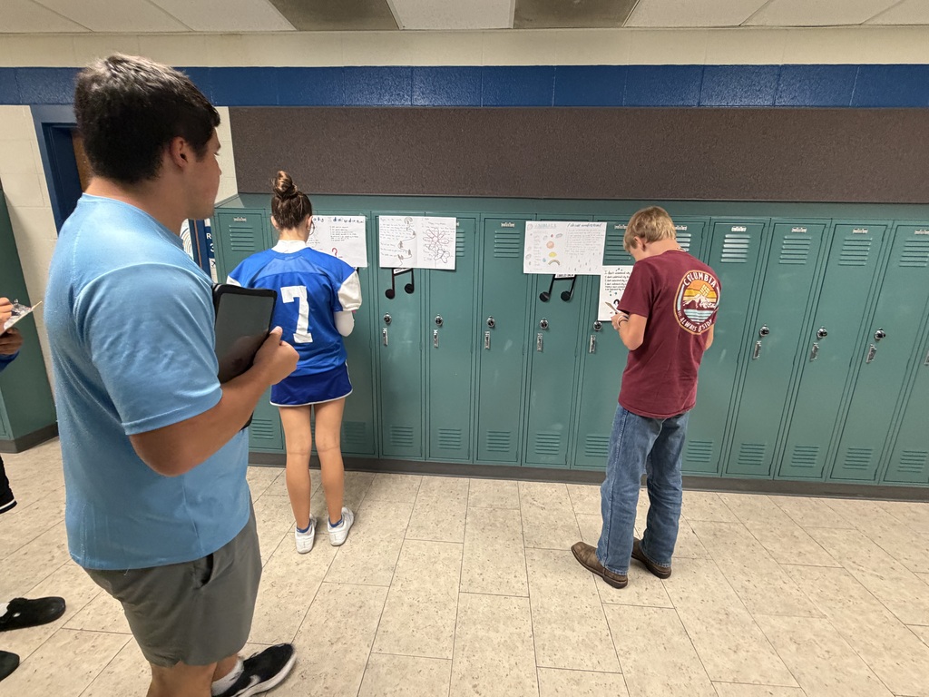 Mrs. Ehlers' 8th-grade ELA class participate in a Poetry Gallery Walk to showcase their creative writing skills. 
