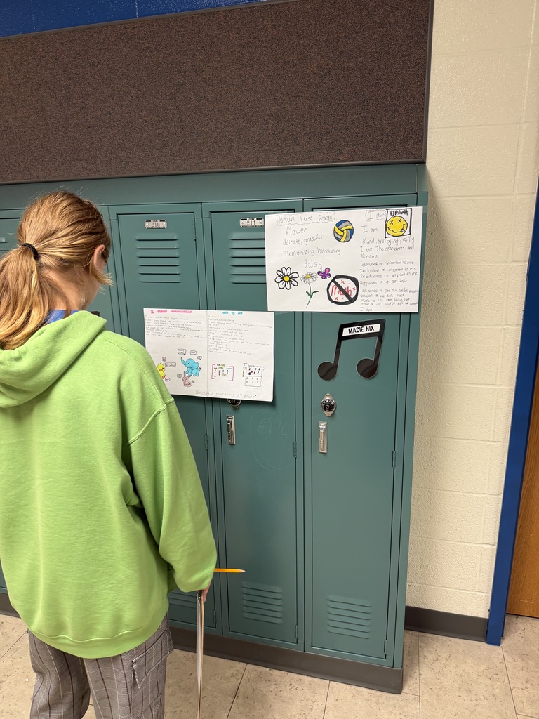 Mrs. Ehlers' 8th-grade ELA class participate in a Poetry Gallery Walk to showcase their creative writing skills. 