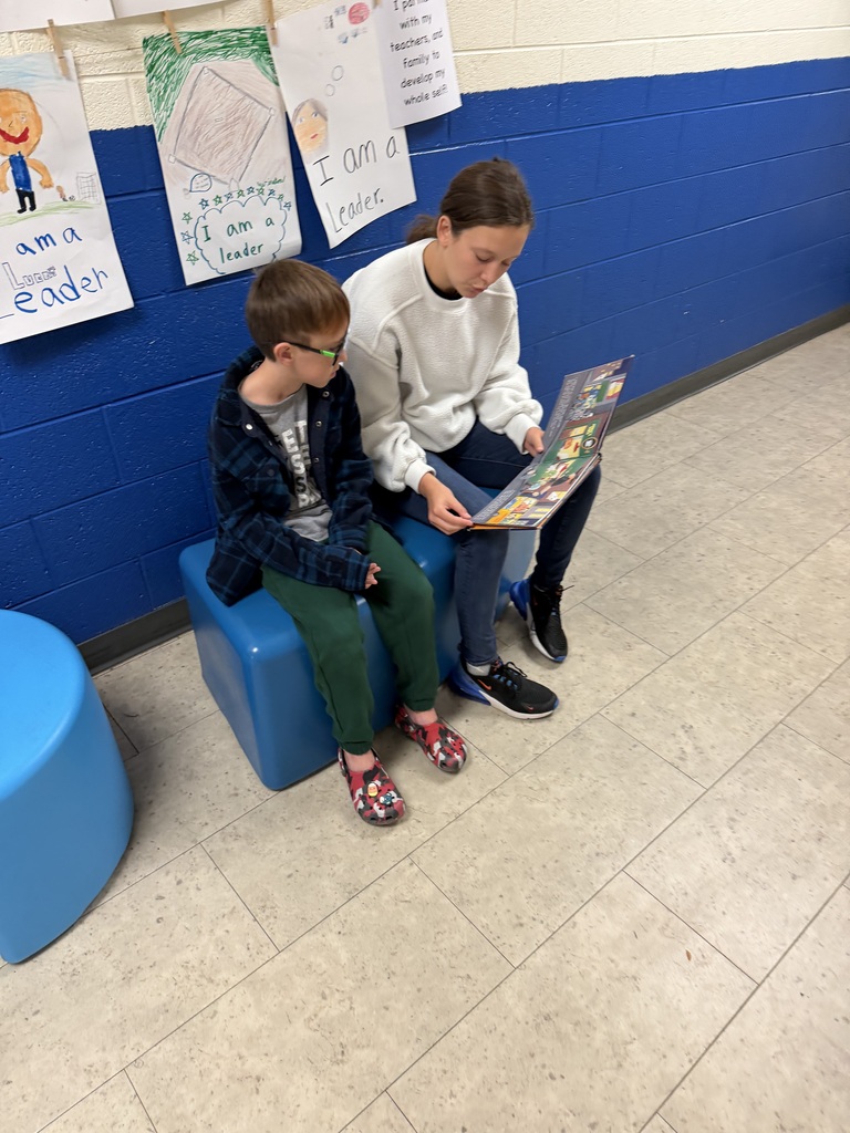 The 9th graders read to 4th graders as part of a program that was started last year.