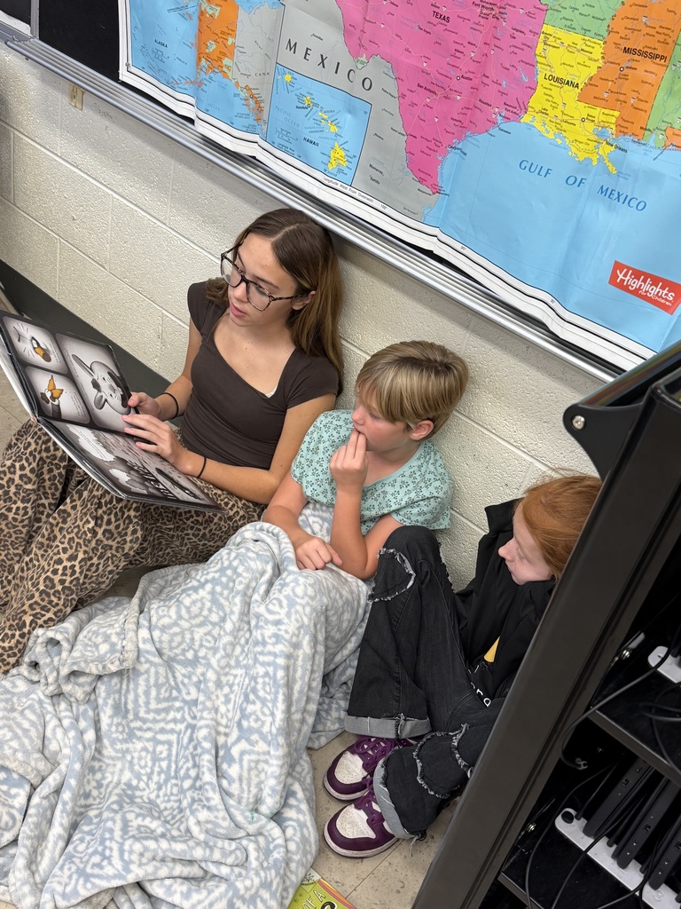The 9th graders read to 4th graders as part of a program that was started last year.