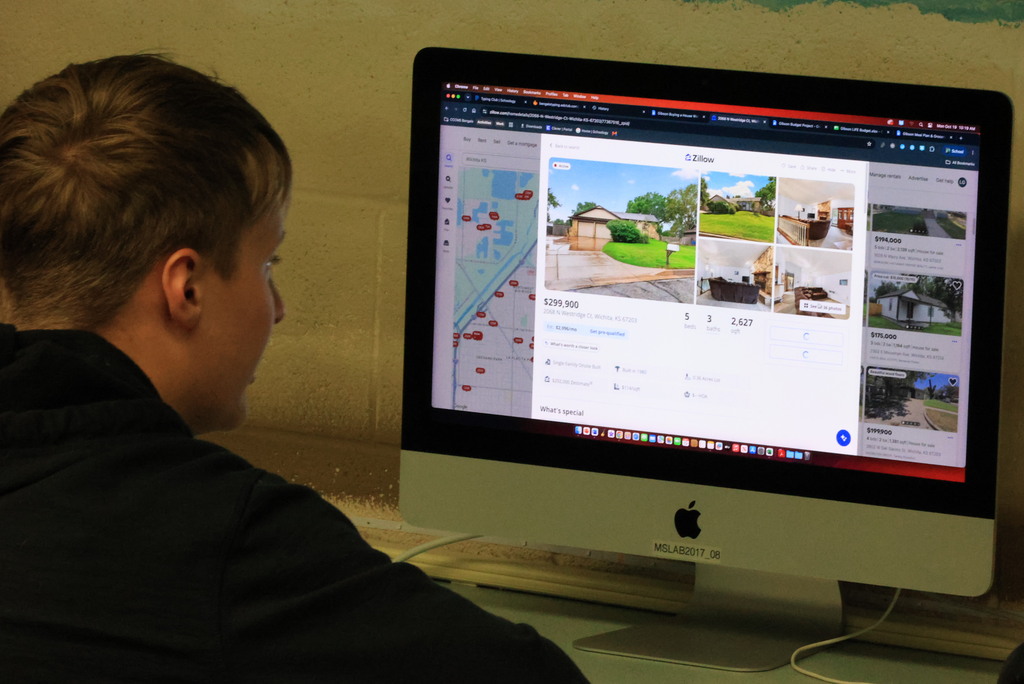 Students look up possible houses to purchase on Zillow in Mr. Lane's comupters class.