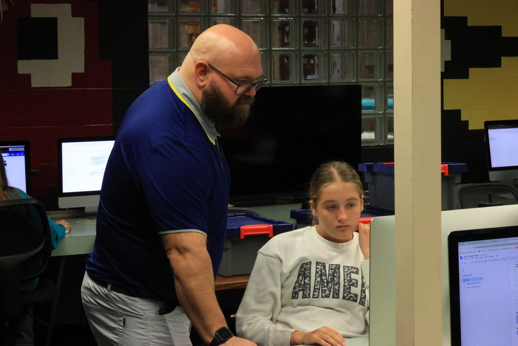 Students look up possible houses to purchase on Zillow in Mr. Lane's comupters class.