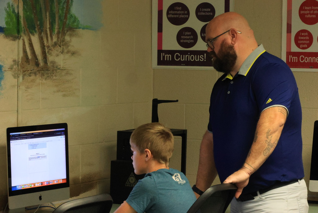 Students look up possible houses to purchase on Zillow in Mr. Lane's comupters class.