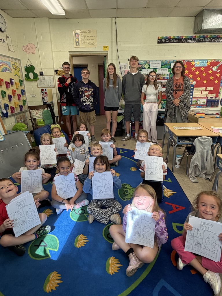 Miss Looney's art class poses with the K-1 class at Wakefield with their new coloring books.