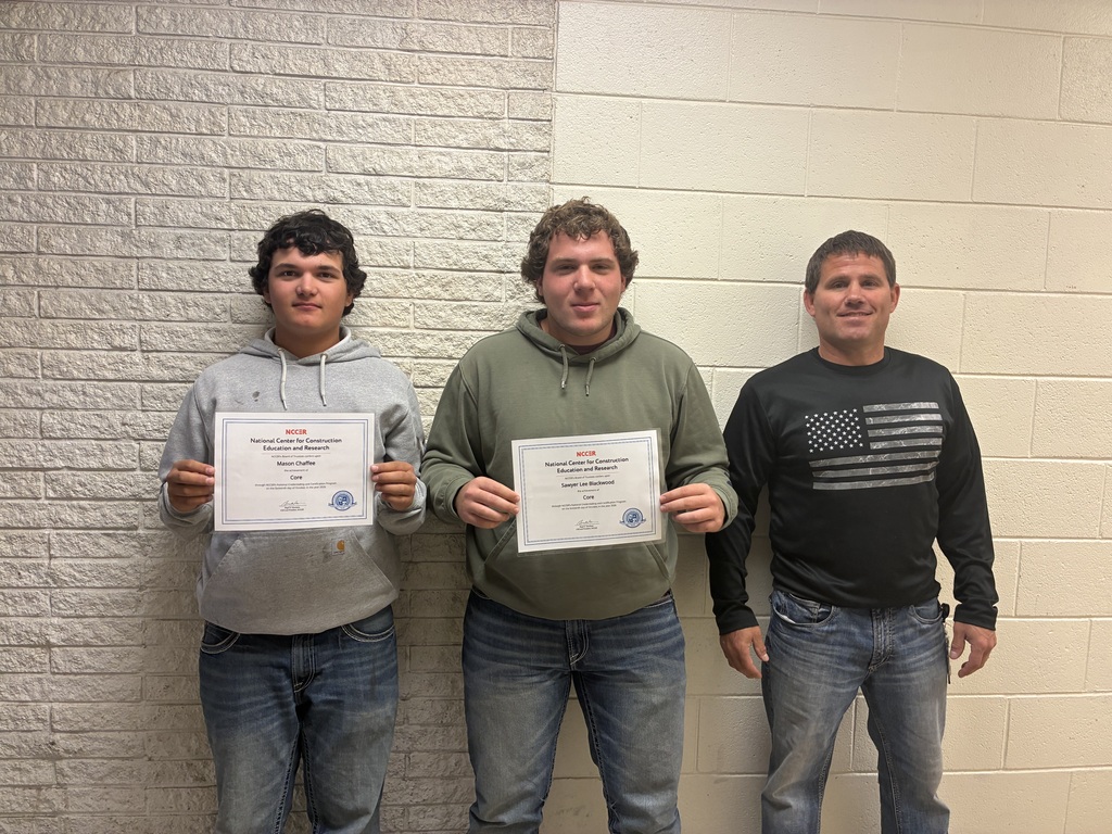 Mason Chaffee and Sawyer Blackwood have earned NCCER’s Core Credential!. They pose with their certificates with teacher Brandon Pfizenmaier.