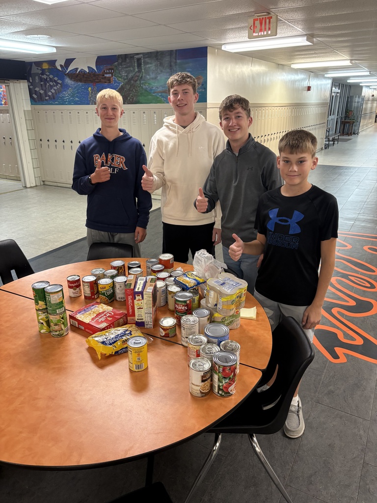 CCCHS FBLA members pose with their trick-or-treat for canned goods itmes.