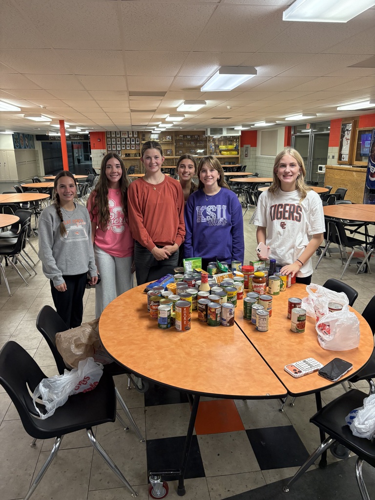 CCCHS FBLA members pose with their trick-or-treat for canned goods itmes.