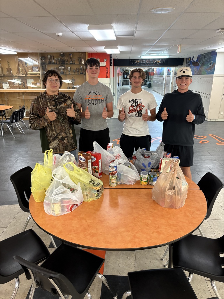 CCCHS FBLA members pose with their trick-or-treat for canned goods itmes.