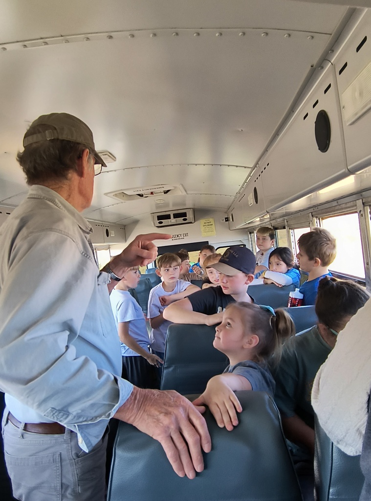 Mrs. Simnitt's 4th graders view bison in a bus during their Konza Prairie field trip