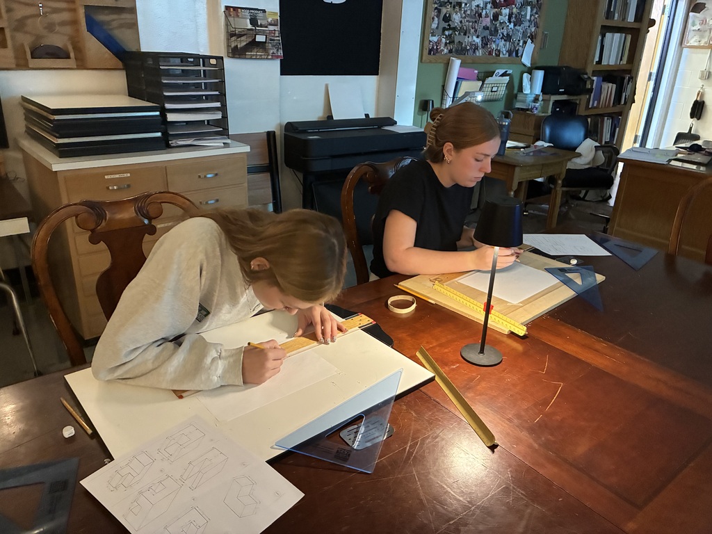 Mrs. Schooley's CAD I & II classes work on oblique 3D figures using the CAD program.