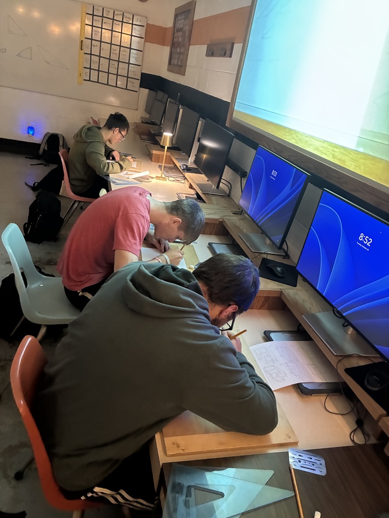 Mrs. Schooley's CAD I & II classes work on oblique 3D figures using the CAD program.