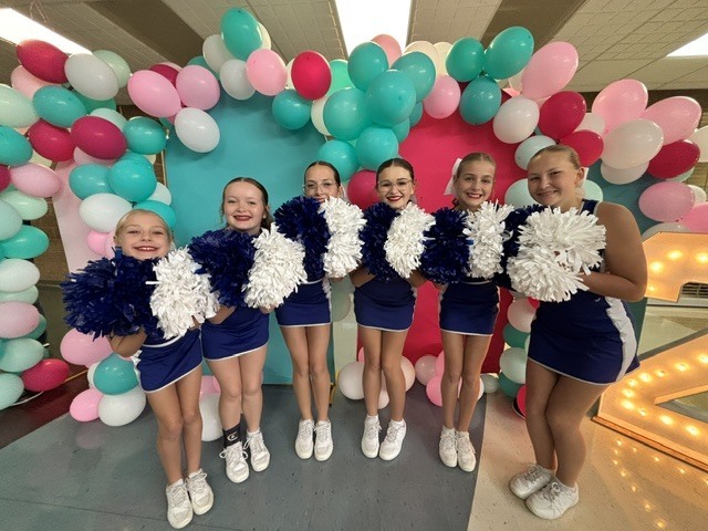 The Wakefield HS Jets cheerleading squad performs at the Sunflower Showdown compeition.