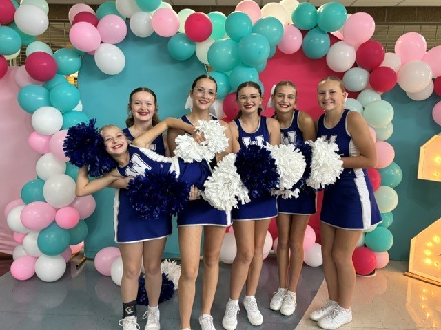 The Wakefield HS Jets cheerleading squad performs at the Sunflower Showdown compeition.