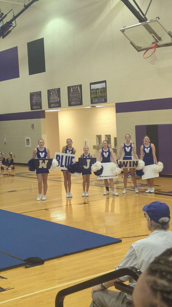 The Wakefield HS Jets cheerleading squad performs at the Sunflower Showdown compeition.