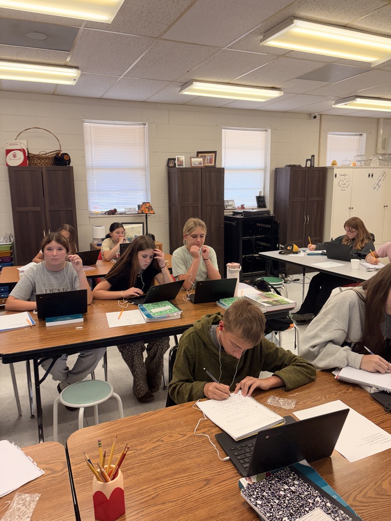 students taking a test in a classroom
