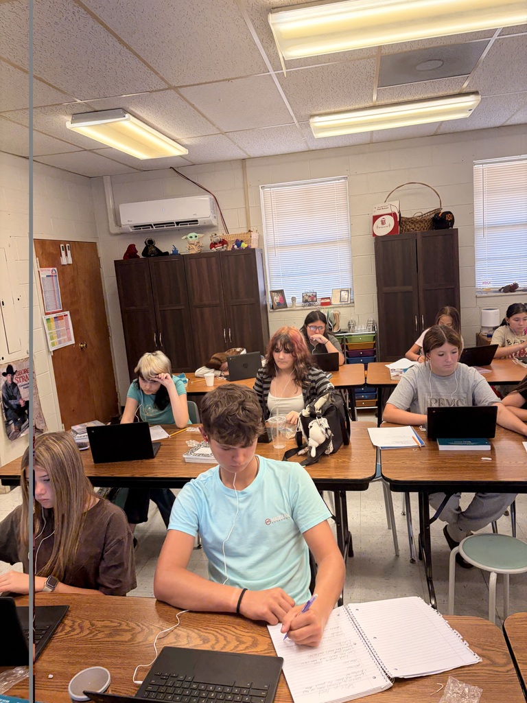 students taking a test in a classroom