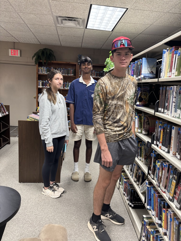 PHOTO OF STUDENT LOOKING LEARNING ABOUT COLLECTION