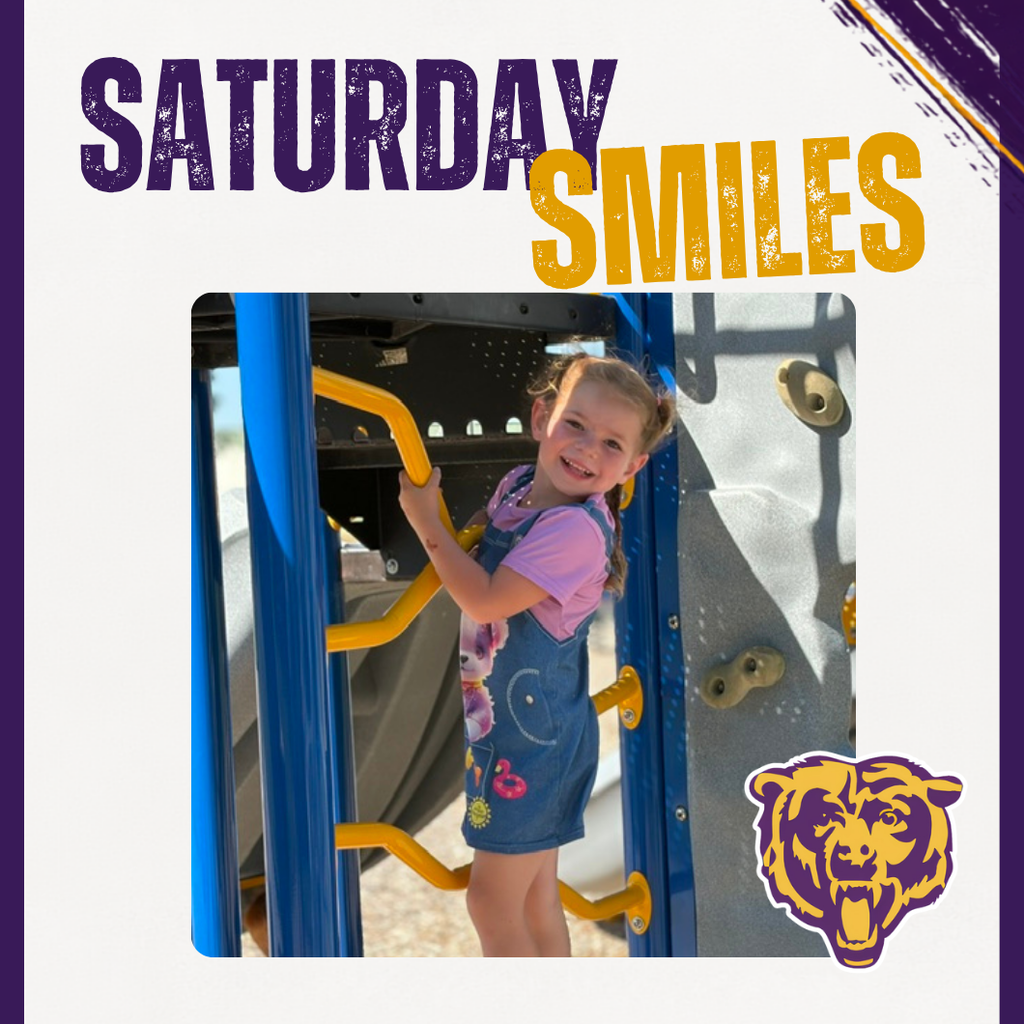 A smiling student on the playground. 