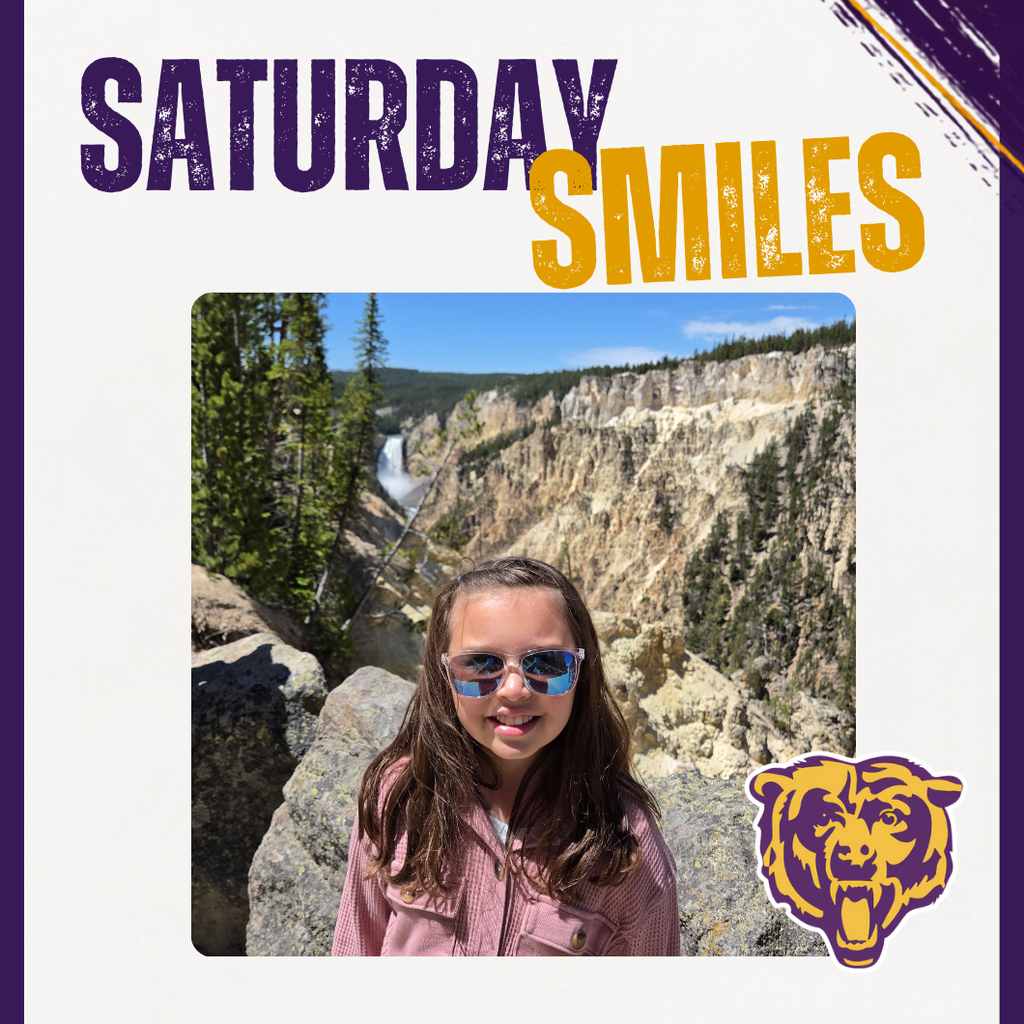 Saturday Smiles Graphic. Showing a student smiling in front of a rocky background. 
