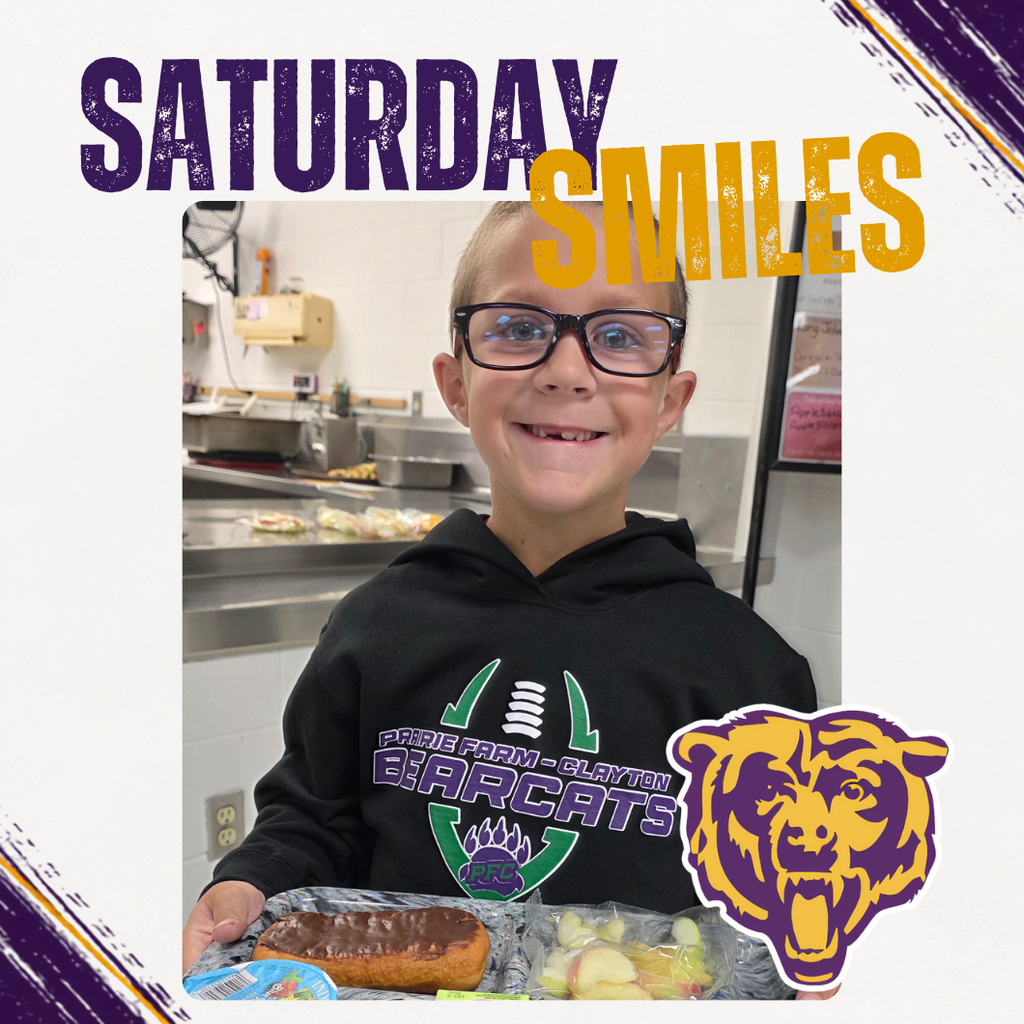 Saturday Smiles Post with a student smiling with a lunch tray