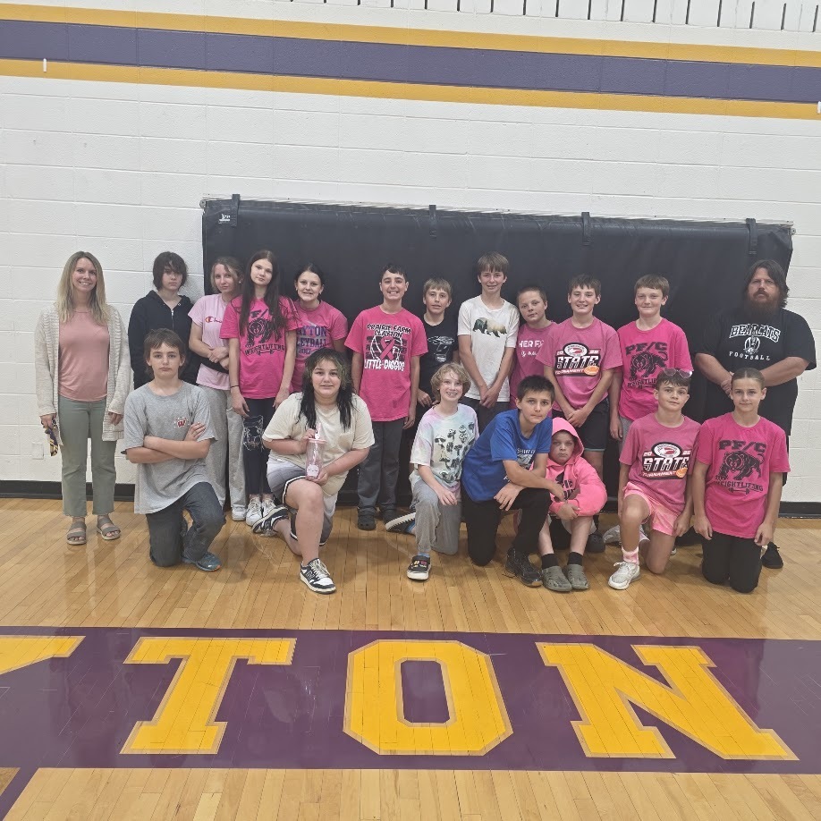 Color dress up day photos with students wearing colors matching their class.