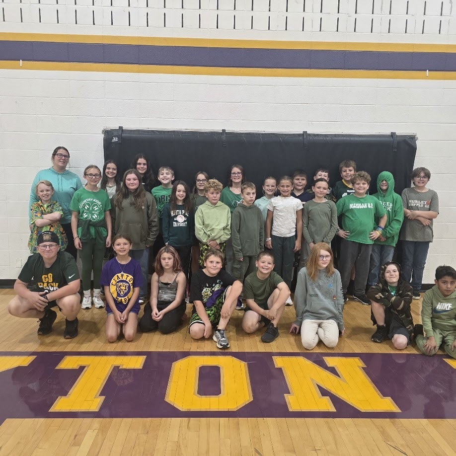 Color dress up day photos with students wearing colors matching their class.