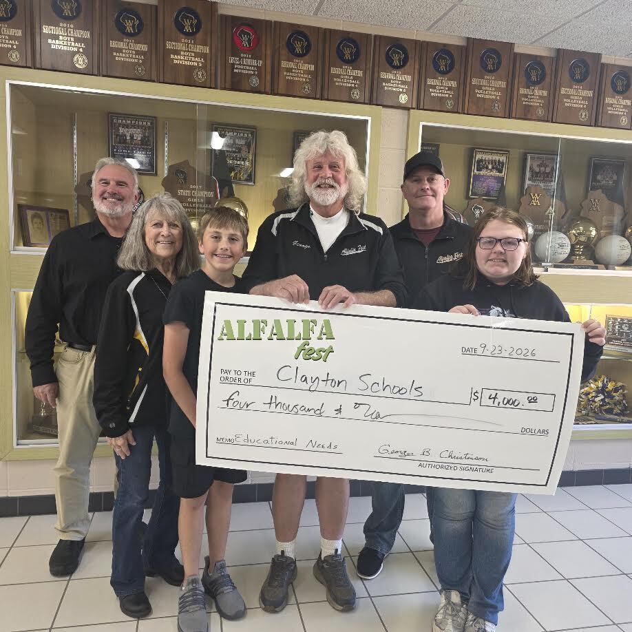 Alfafa Fest Picture with Students holding a check for donation