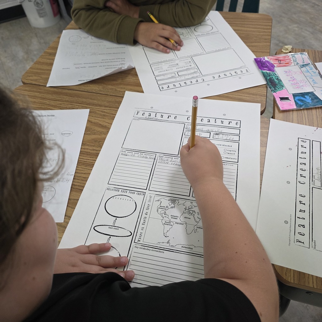 Students in the classroom learning about creatures