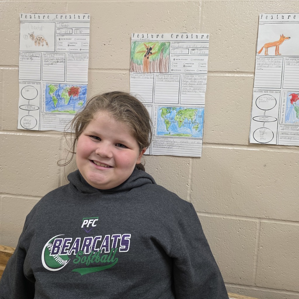 Students in the classroom learning about creatures